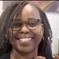 A person smiling at the cameraAI-generated content may be incorrect.