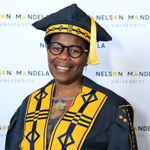 A person in a graduation gown and capAI-generated content may be incorrect.