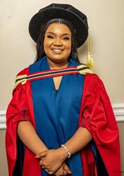 A person in a graduation gownAI-generated content may be incorrect.